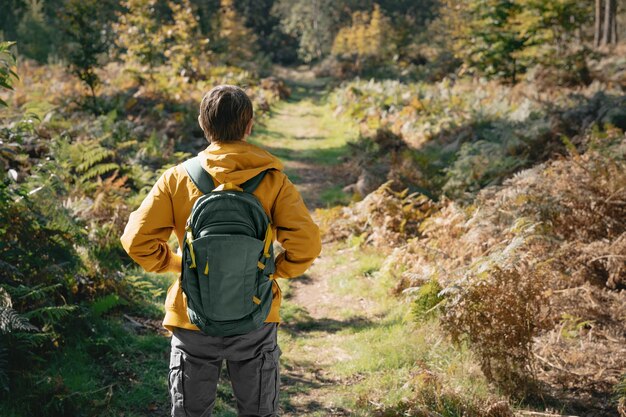 Traveler walking in forest trail with backpack – Outdoor Activities in Ifrane